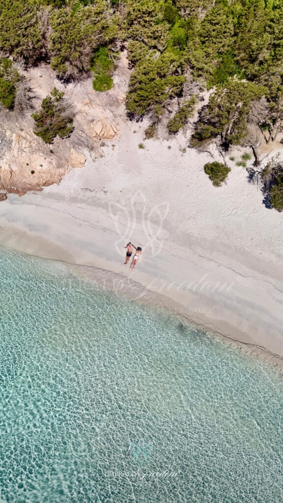 Woman relaxing in the crystal-clear waters during a private guided boat trip La Maddalena islands, enjoying the serene beauty of the Archipelago