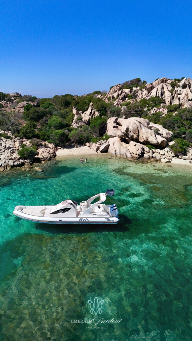 Boat in the turquoise sea of the La Maddalena Archipelago - private boat tour